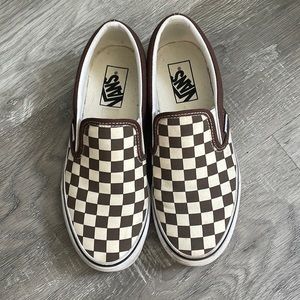 Brown and white checkered Vans.
